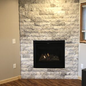 Close up of gas insert with dry stacked stone.