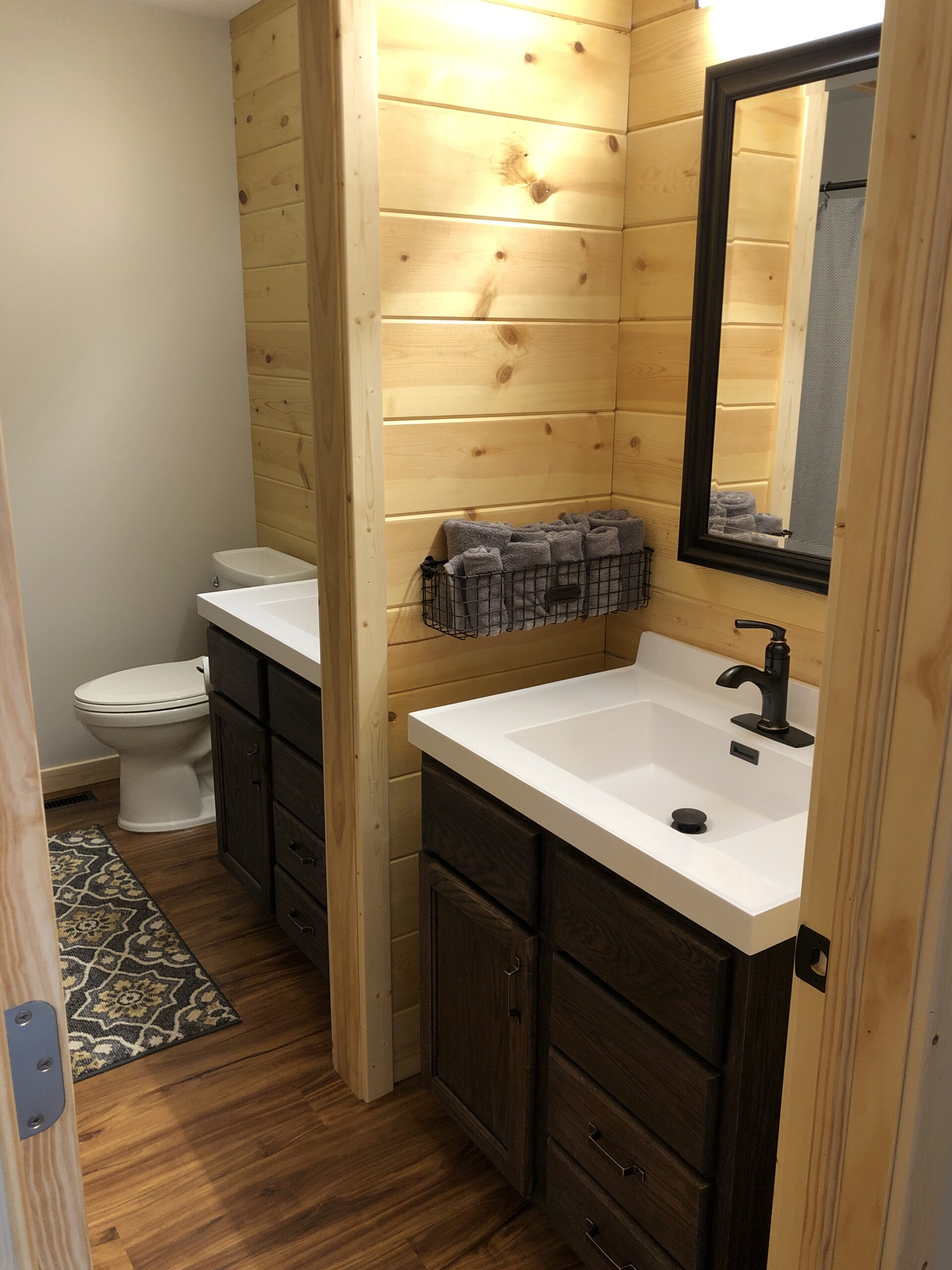 Double vanity and toilet now with pocket door to create two spaces (After)