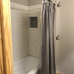 New tub with custom tile surround. (After)