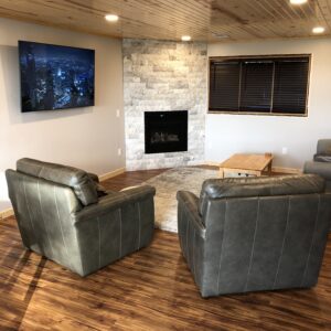 Basement family Room (After) New Gas insert along with dry stacked stone.