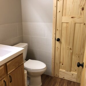 1/4 bath refresh: (after) Added entry door to make an on suite.