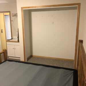 Closet and vanity in large bedroom. (Before)