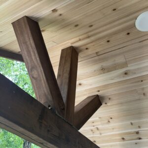 Tonge and groove cedar lines the underside for a look smooth finish.